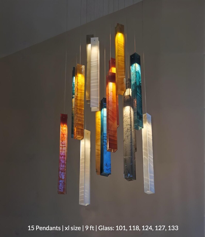 a collection of colorful glass pendant lights suspended from the ceiling, creating a visually striking and vibrant display.