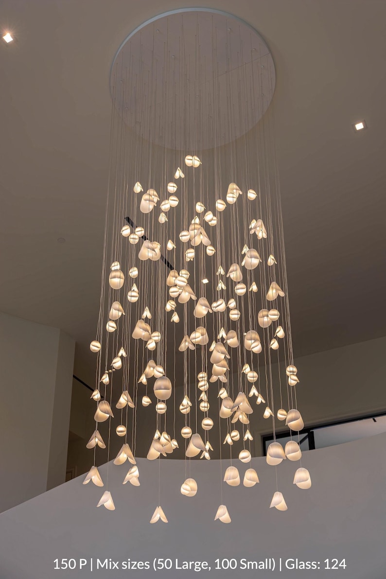 a chandelier made of glass balls hanging from the ceiling
