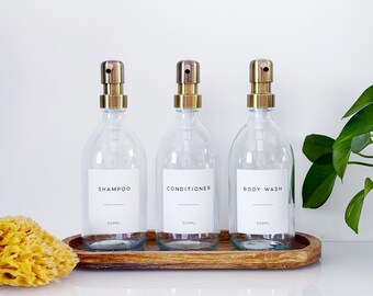 Set Of 3 Clear Bottles - Glass Or Plastic - Shampoo, Conditioner & Body Wash - Brushed Gold Metal Pumps