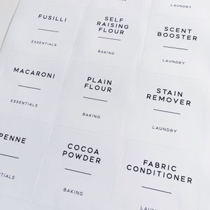 May include: Nine white square labels with black text. The labels are for various kitchen and laundry items. The labels include: Fusilli, Self Raising Flour, Scent Booster, Macaroni, Plain Flour, Stain Remover, Penne, Cocoa Powder, and Fabric Conditioner.