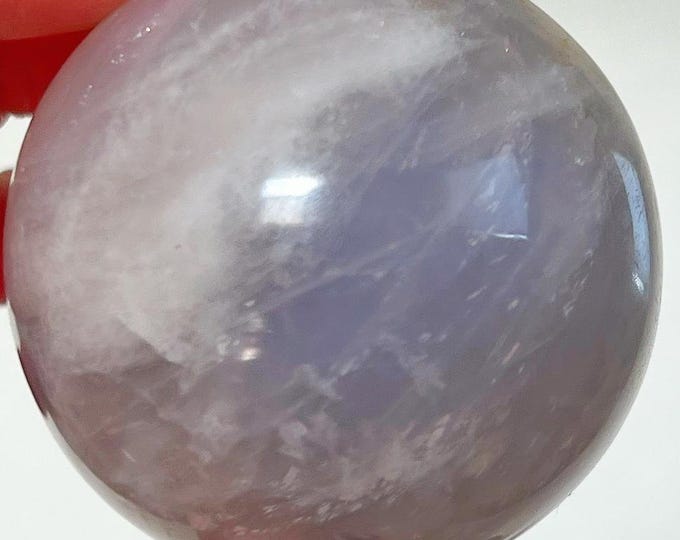 pigmented blue rose quartz sphere with iron inclusions