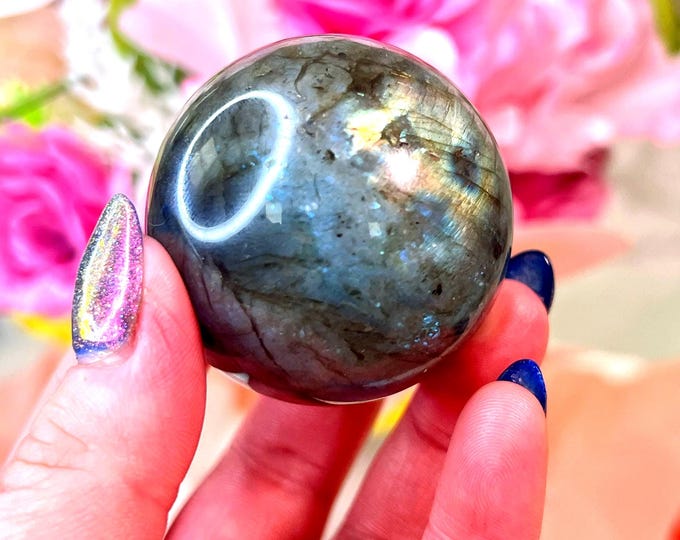 labradorite sphere with golden teal flash