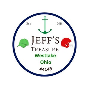 May include: A circular logo with a navy blue border. The logo features a green anchor, a green baseball cap, and a red football helmet. The text reads "JEFF'S TREASURE Westlake Ohio 44145". The logo also includes the text "EST 2018".