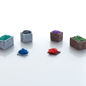 May include: Five miniature wooden crates filled with different colored plastic gems. The crates are arranged in a semi-circle on a white surface. The gems are green, blue, purple, black, and red.