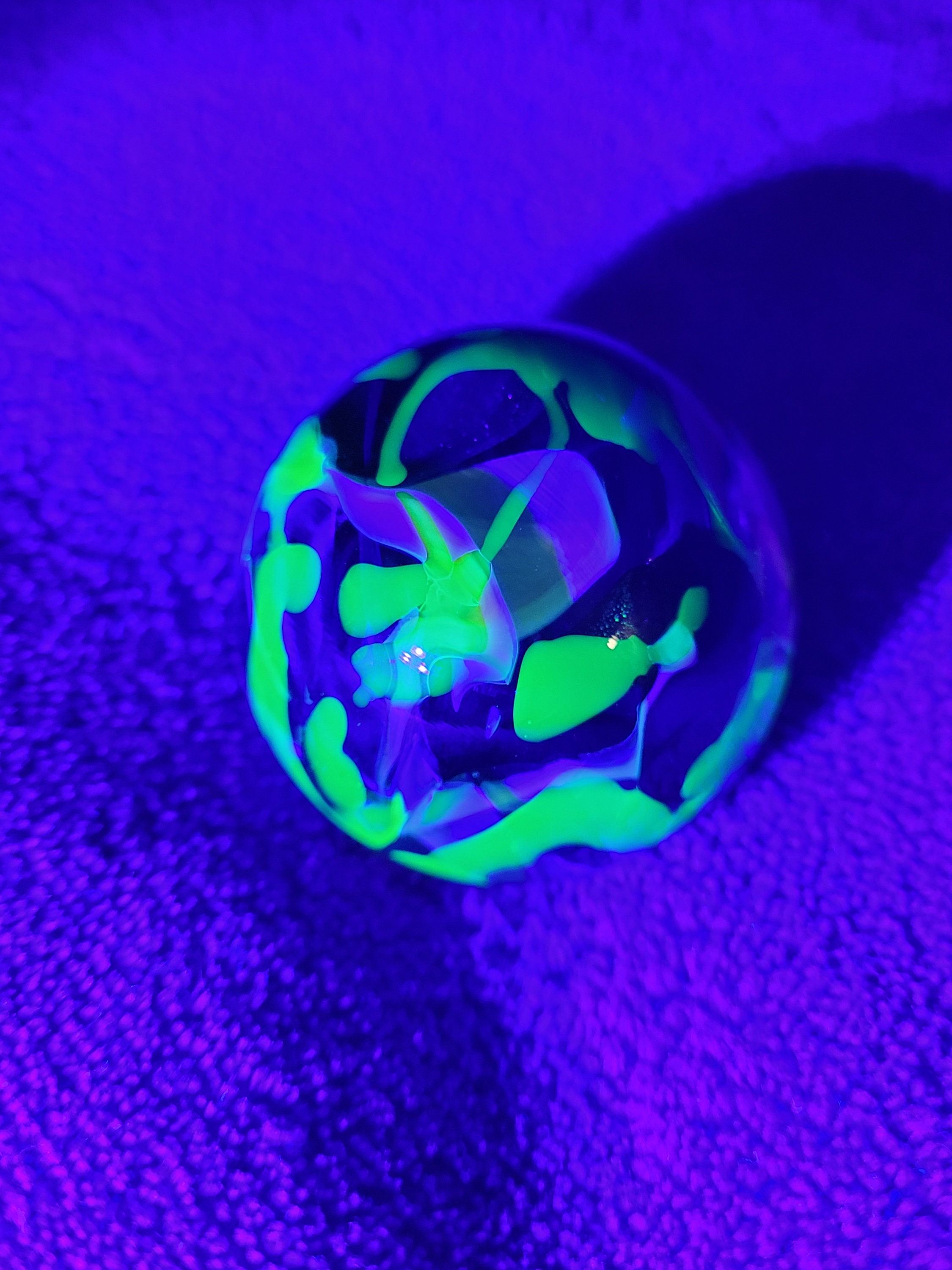 Received some marbles as a gift. They seem a little darker than normal  uranium glass but still fluoresce. The larger darker red marbles fluoresce  too although it's hard to see in the