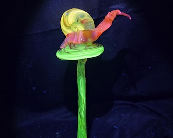 Uranium glass snail on mushroom sculpture
