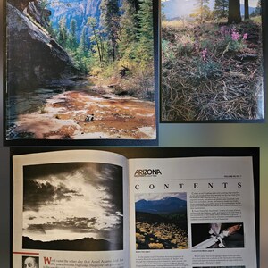 May include: A collection of Arizona Highways magazines. The cover of one magazine features a landscape with a river and trees. Another shows a mountain scene with purple flowers. An open magazine displays black and white photography.