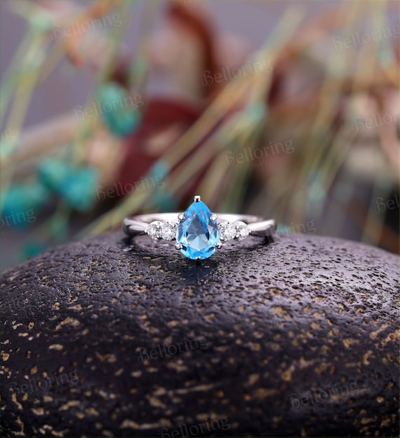 Swiss blue on sale topaz engagement ring