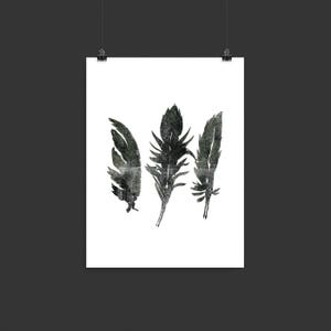 May include: Three black and white watercolour feathers on a white background.