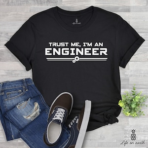 May include: Black t-shirt with white text that reads "Trust me, I'm an Engineer" with two gear icons below the text.
