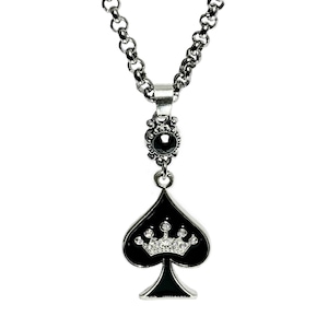 May include: A silver necklace with a black spade pendant featuring a crown of white rhinestones. The pendant has a black onyx stone at the top.