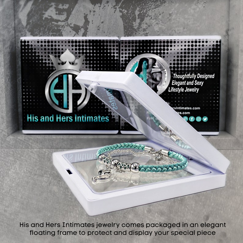 May include: A teal blue braided bracelet with silver charms and beads is displayed in a white floating frame. The frame has a black and white background with the text "His and Hers Intimates" and "Thoughtfully Designed Elegant and Sexy Lifestyle Jewelry".