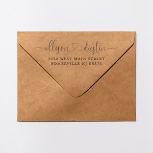 May include: A brown paper envelope with a return address label that reads "allison & dustin" with a heart symbol between the names. The address is 1234 West Main Street, Somerville NJ 08876.
