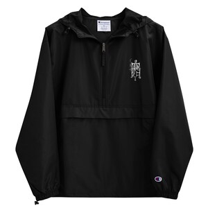 May include: Black Champion brand windbreaker jacket with a zip fastening and a skeleton sitting on a chair graphic on the front.