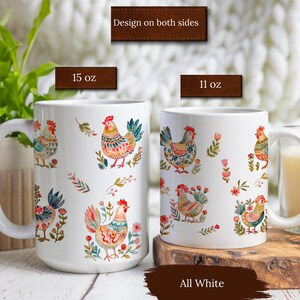 May include: Two white ceramic mugs with a colorful chicken and floral design. The mugs are available in 11 oz and 15 oz sizes. The text "Design on both sides" and "All White" are visible on the image.