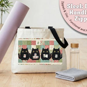May include: A cream-colored canvas tote bag featuring black handles and a zipper closure. The front displays a graphic of four black cats playing mahjong against a background of colorful, small-scale floral and geometric quilt-style fabric patches.