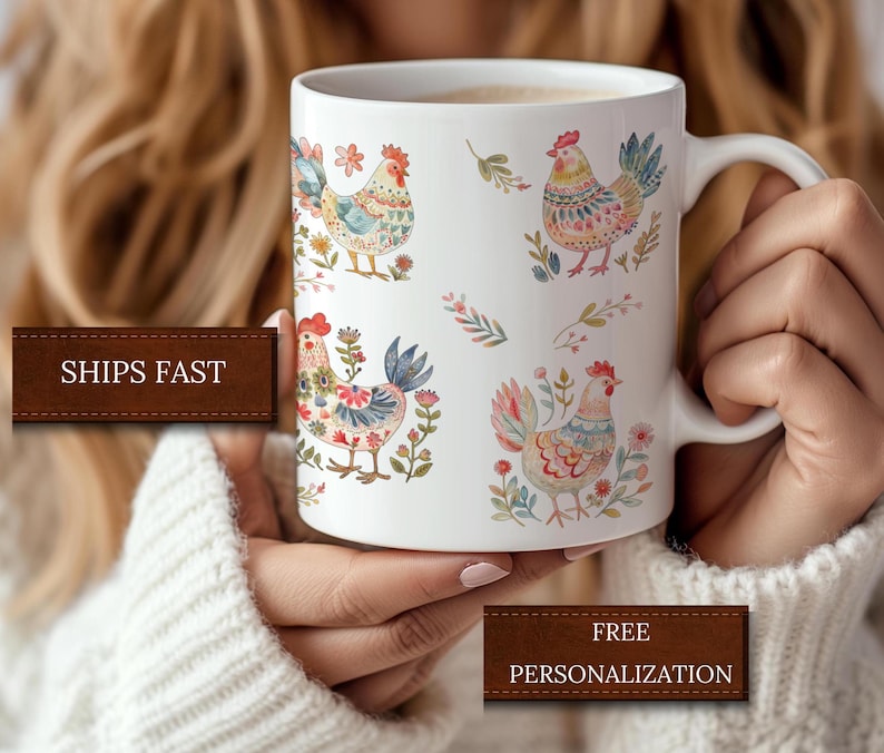 May include: White ceramic mug with a colorful rooster design. The rooster is depicted in a watercolor style with floral accents. The mug has a handle and is suitable for hot beverages.