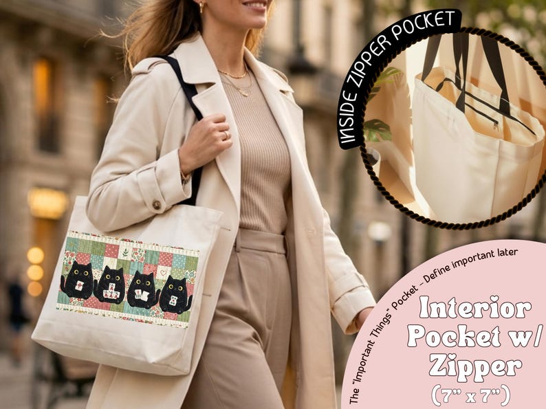 May include: A cream-colored canvas tote bag featuring a horizontal patchwork-style panel with four black cat illustrations. The bag includes an interior pocket with a zipper measuring 7 inches by 7 inches, labeled as the Important Things Pocket.