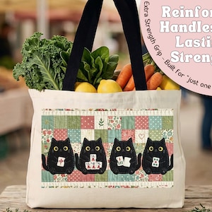 May include: A cream-colored canvas tote bag with black handles, filled with fresh kale, carrots, and lemons. The front features a patchwork design with four black cats holding mahjong tiles. Text reads: Reinforced Handles for Lasting Strength.