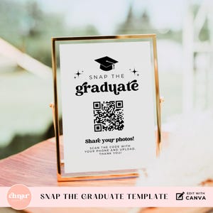 May include: A graduation party sign with a gold frame. The sign reads "SNAP THE graduate" with a QR code and the text "Share your photos!" in black font. The bottom of the sign says "SNAP THE GRADUATE TEMPLATE".