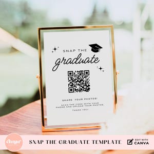 May include: A framed graduation sign with the text "Snap the Graduate" in elegant script. The sign includes a QR code and instructions to share photos. The frame is gold, and the background is white.