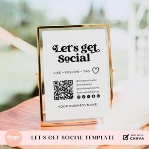 May include: A gold-framed sign with the text "Let's get Social" in a decorative font. The sign includes a QR code, social media icons, and the words "Like, Follow, Tag." The bottom of the sign says "Your Business Name."