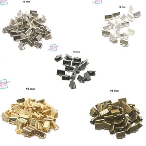 May include: Four piles of 10 mm metal clasps in different finishes: silver, black, gold, and antique brass. The clasps are all the same size and shape, but they have different finishes.
