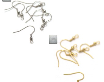 May include: A set of silver and gold earring hooks. The silver hooks are on the left and the gold hooks are on the right. The hooks are all the same size and shape. They are made of metal and have a small loop at the top. The hooks are perfect for making earrings.