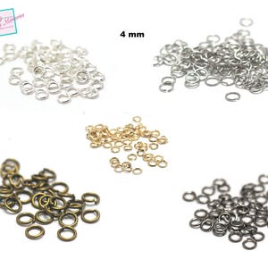 Può includere: Assortimento di anelli aperti in quattro colori diversi: argento, oro, bronzo e nero. Gli anelli aperti hanno un diametro di 4 mm.
