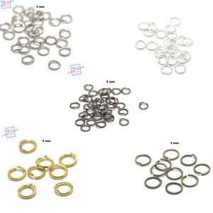 Peut inclure: Assortiment de 5 mm anneaux ouverts en argent, noir, or et bronze. Les anneaux ouverts sont en métal et sont parfaits pour la fabrication de bijoux.