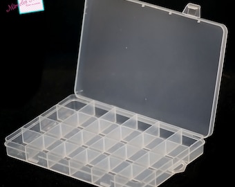 May include: A clear plastic storage box with 24 compartments. The box has a hinged lid and measures 4.19 inches by 3 inches by 2.2 cm.