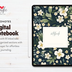 Könnte beinhalten: Digitales Notizbuch mit floralem Muster. Das Tablet zeigt einen dunkelblauen Hintergrund mit weißen Blumen und grünen Blättern. Das Wort "notebook" ist kursiv geschrieben. Der Text "GOODNOTES Digital Notebook" ist ebenfalls sichtbar.