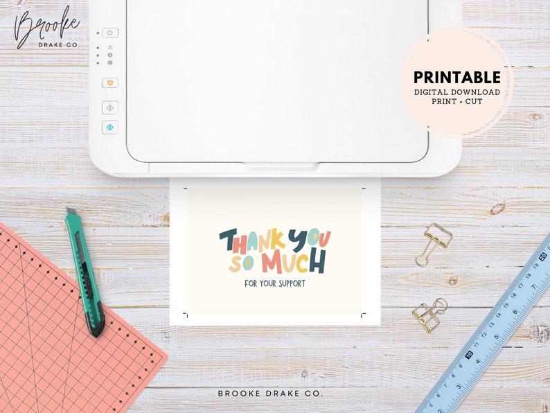 May include: Printable thank you card with colorful text that reads "Thank You So Much" and "For Your Support". The card is being printed on a white printer.