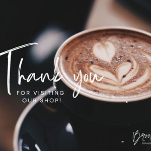 May include: A close-up of a cup of coffee with latte art. The text "Thank you for visiting our shop!" is written in white on a black background. The text "Brooke Drake Co." is written in white on a black background.