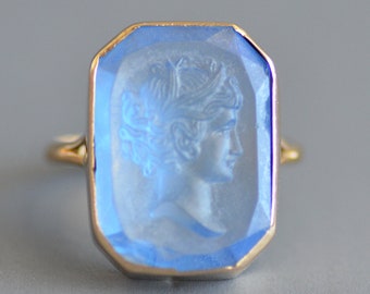 Antique Victorian period carved cornflower blue figural intaglio signet ring in 14k gold