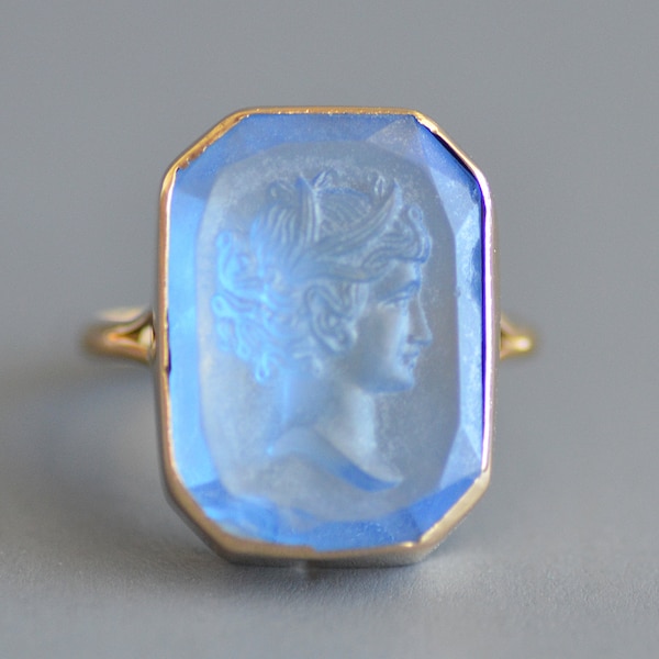 Antique Victorian period carved cornflower blue figural intaglio signet ring in 14k gold