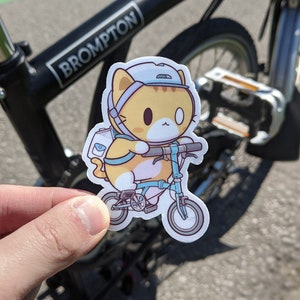 Autocollant en vinyle chat sur un vélo (3 pouces)