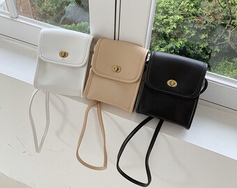 mini sling bag coach