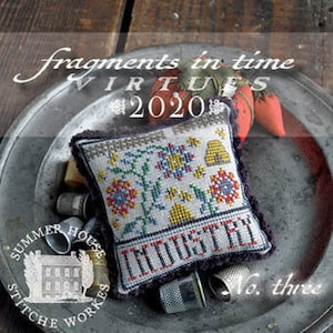 May include: A cross-stitch sampler pillow with the word "INDUSTRY" stitched across the bottom. The pillow features floral and beehive designs in a variety of colors. The text "fragments in time" and "VIRTUES 2020" are above the pillow. The image is on a metal plate.