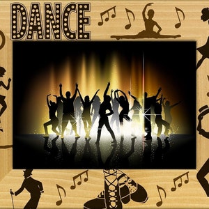 May include: A wooden picture frame with a brown background and the word "DANCE" in white letters with black polka dots. The frame has a silhouette of dancers in the center and musical notes around the edges.