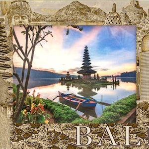 May include: A framed image of a Balinese temple on a lake at sunset. The frame has etched images of a statue, buildings, and mountains. A small boat is in the foreground, and the word "BALI" is at the bottom.
