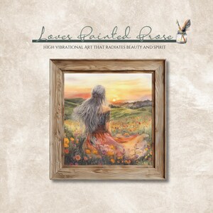 May include: A painting of a woman with long, flowing silver hair sitting in a field of wildflowers. The woman is wearing a long, flowing dress and is looking out at a sunset. The painting is framed in a rustic wooden frame.