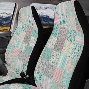 May include: A pair of car seat covers featuring a patchwork design of squares in shades of mint green, soft pink, and white. The pattern includes various floral prints, small roses, daisies, and striped motifs covering the front and back panels.