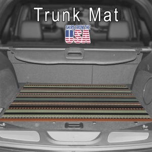 May include: A rectangular trunk mat featuring a horizontal striped pattern in shades of brown, black, teal, and tan with geometric accents. The text "Trunk Mat" and "SHIPS FROM THE USA" with an American flag graphic are visible above the mat.