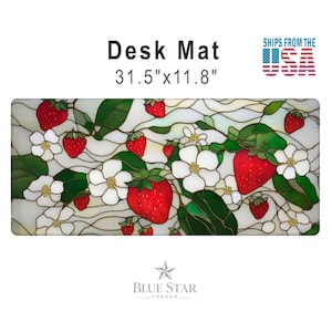 May include: A rectangular desk mat measuring 31.5 inches by 11.8 inches, featuring a stained glass style pattern of red strawberries, white flowers, and green leaves on a light background. The text Desk Mat is printed above the image.