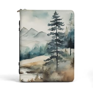 May include: A rectangular zippered portfolio featuring a watercolor landscape print. The design displays tall dark green pine trees in the foreground, a misty forest mid-ground, and light blue mountains in the distance, with a tan ground area.