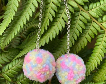 Pastel rainbow Pom Pom dangle earrings on a chain