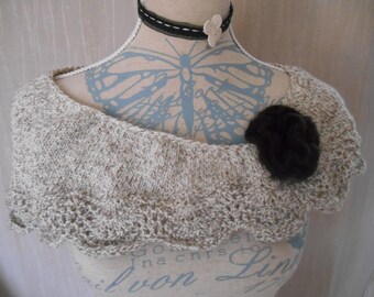 shoulder-warmer with a hand knit scalloped edge