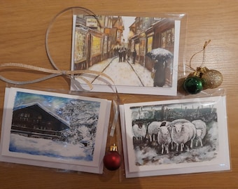 Pack of 3 A6 Winter greetings card designs, 3 different images all featuring snow