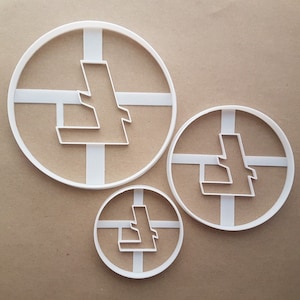 May include: Three white plastic cookie cutters in different sizes, each featuring a stylized letter L design.